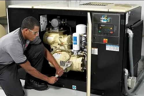 Airmech Solutions technician servicing an air compressor